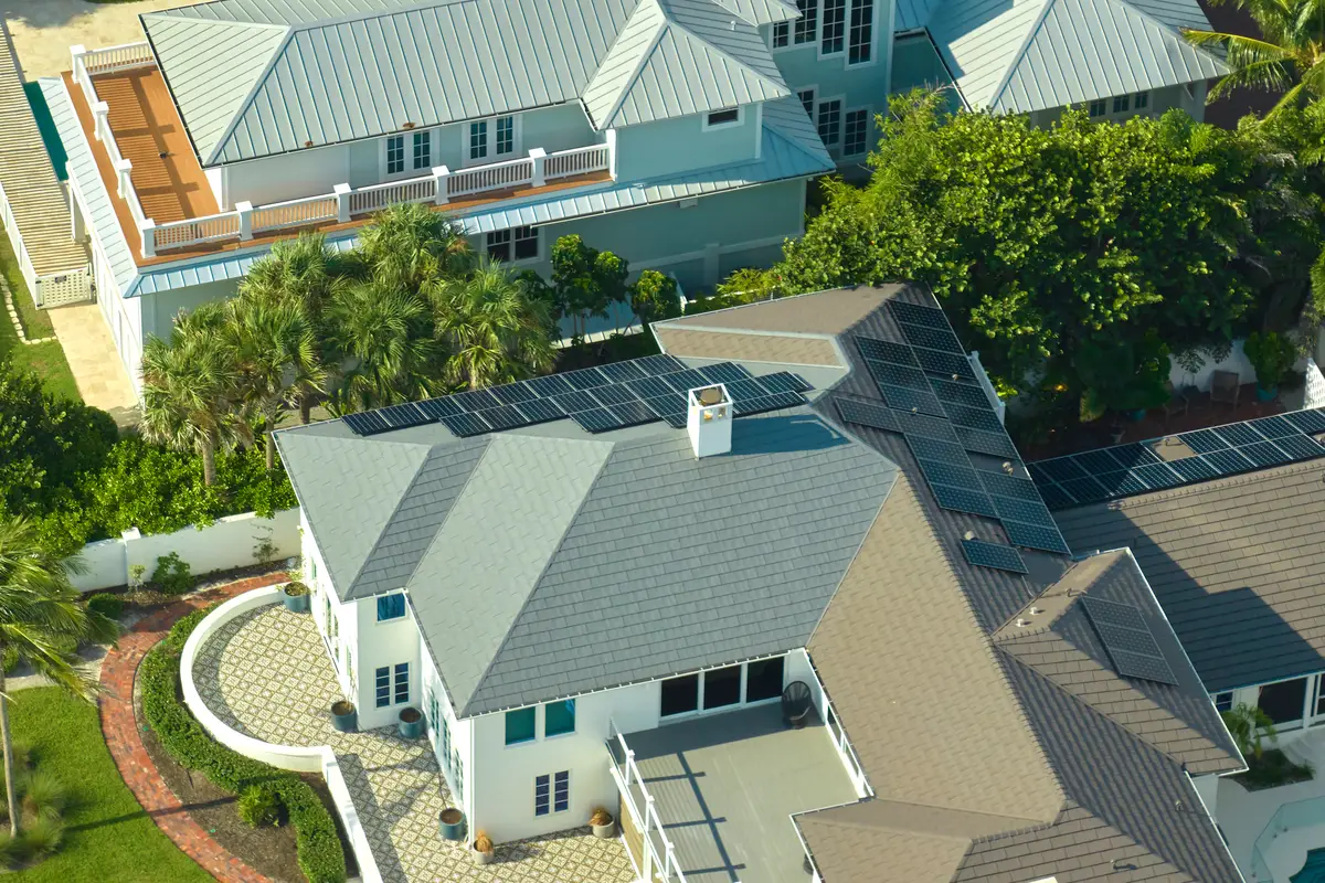 Aerial view of suburban homes with gray roofs