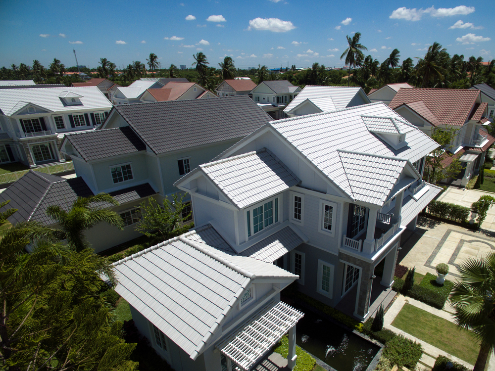 Aerial view of a neighborhood with gray roofs