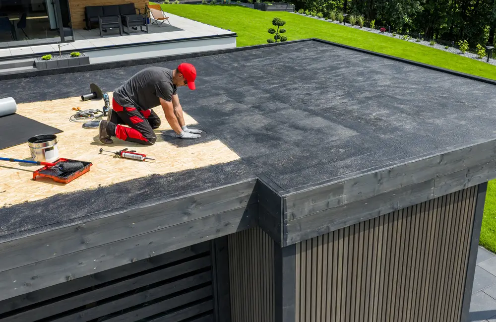 Roofer working on a low-slope roof