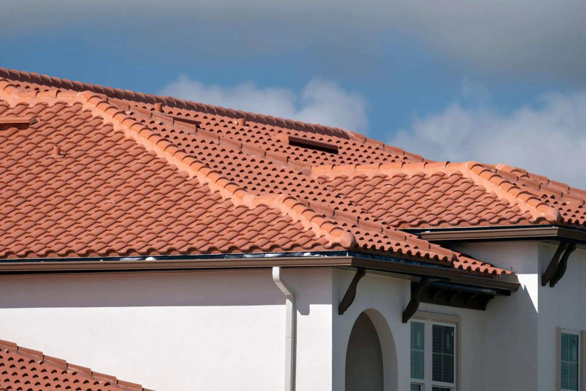 Terracotta tile roof on a white house
