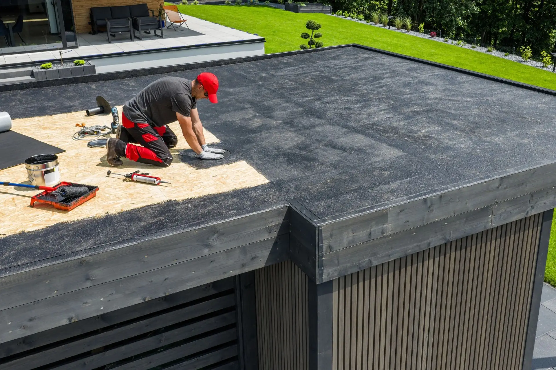 Roofer working on a low-slope roof