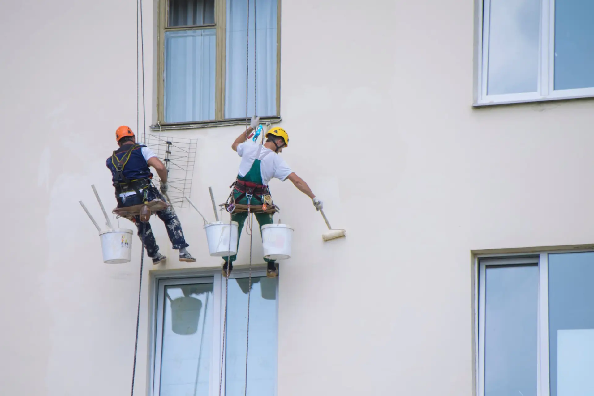 Painters working on a building exterior