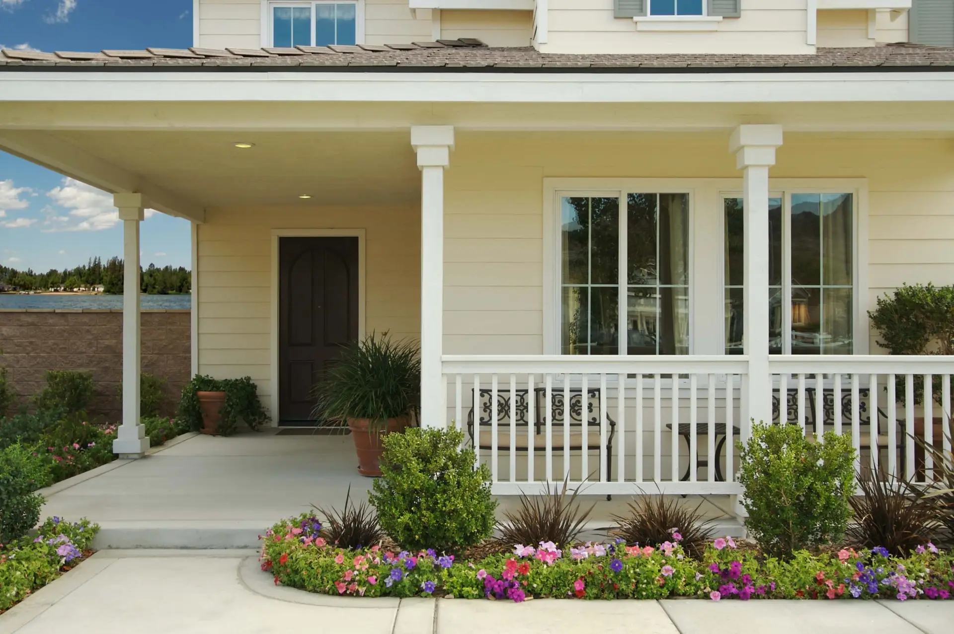 Home with cream siding and a front porch