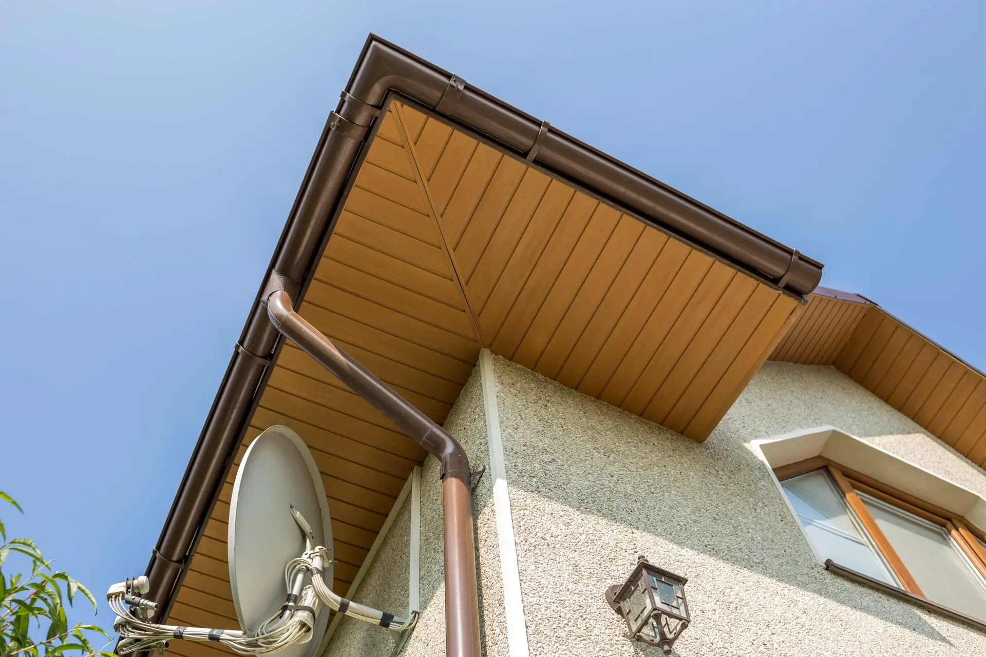 House corner with wood soffit and gutter