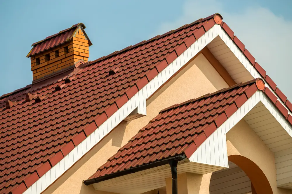 Red tile roof with a brick chimney