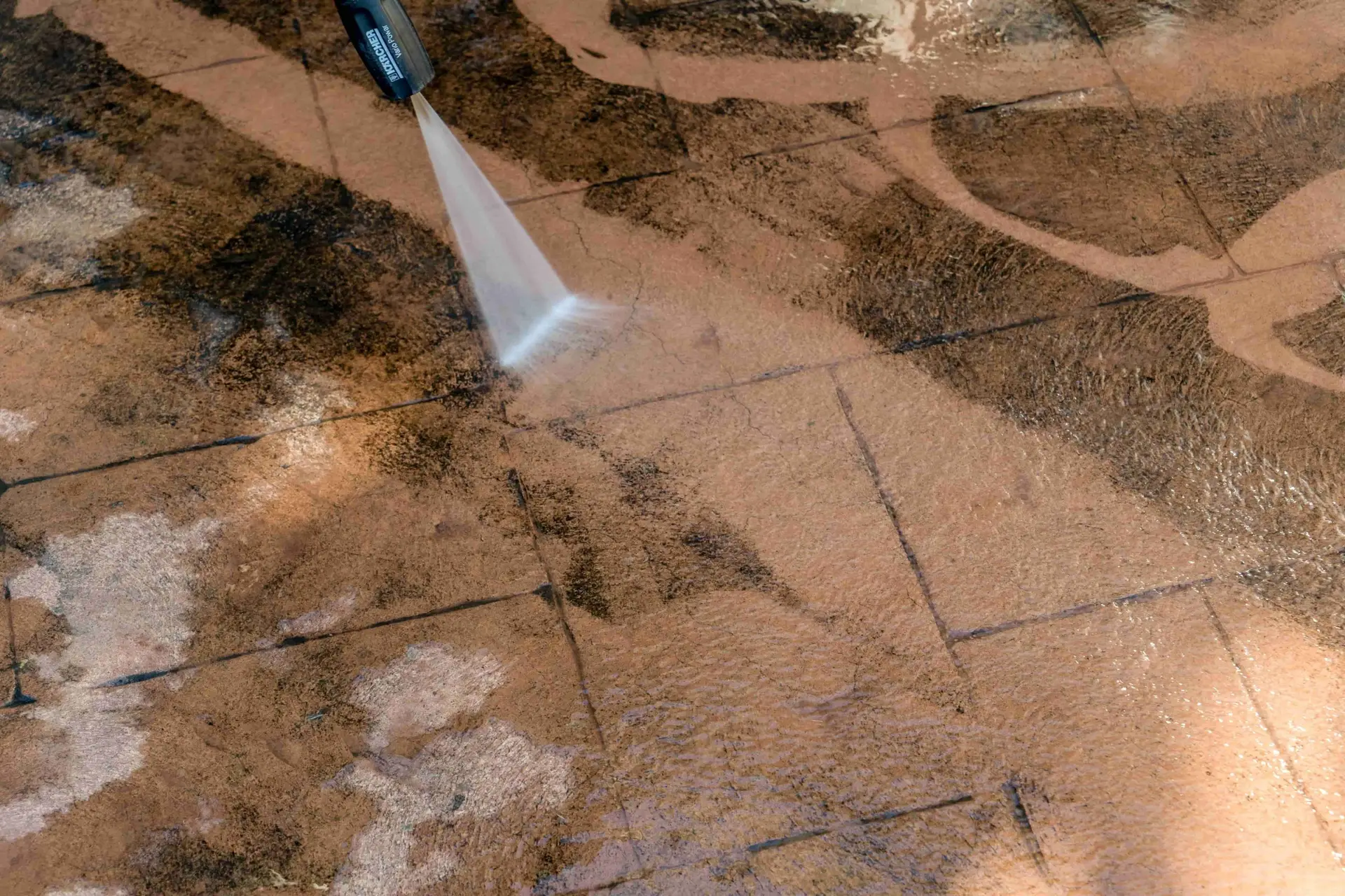 Pressure washing concrete pavers