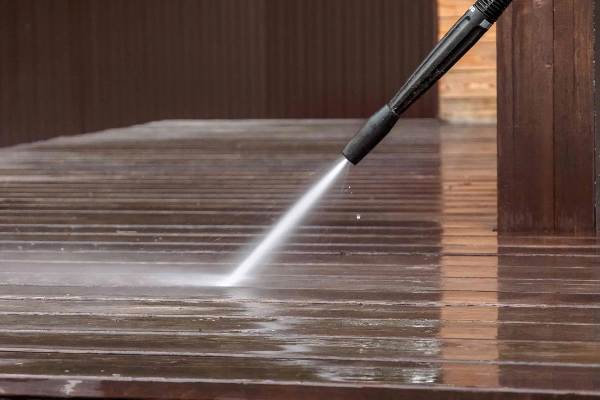 Pressure washing a wooden deck