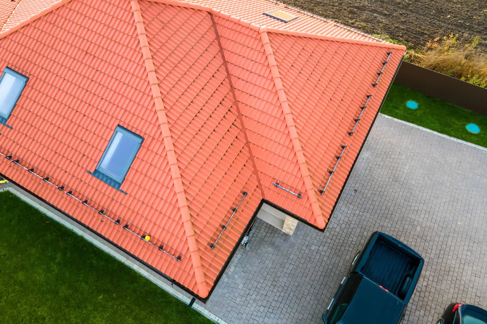 Aerial view of a house with an orange tile roof