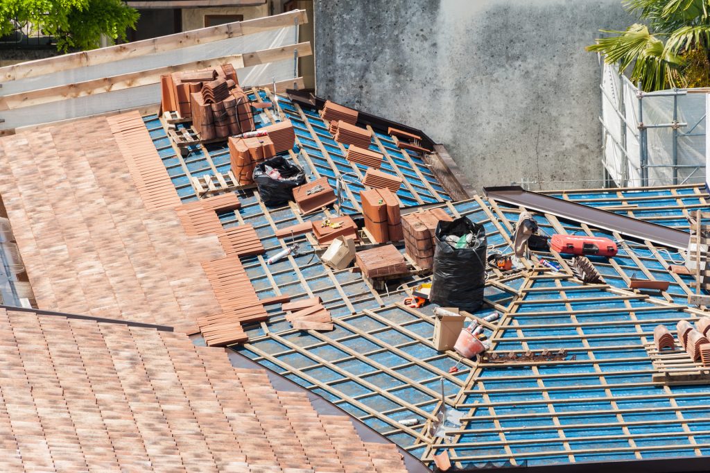 Roof under construction with new terracotta tiles
