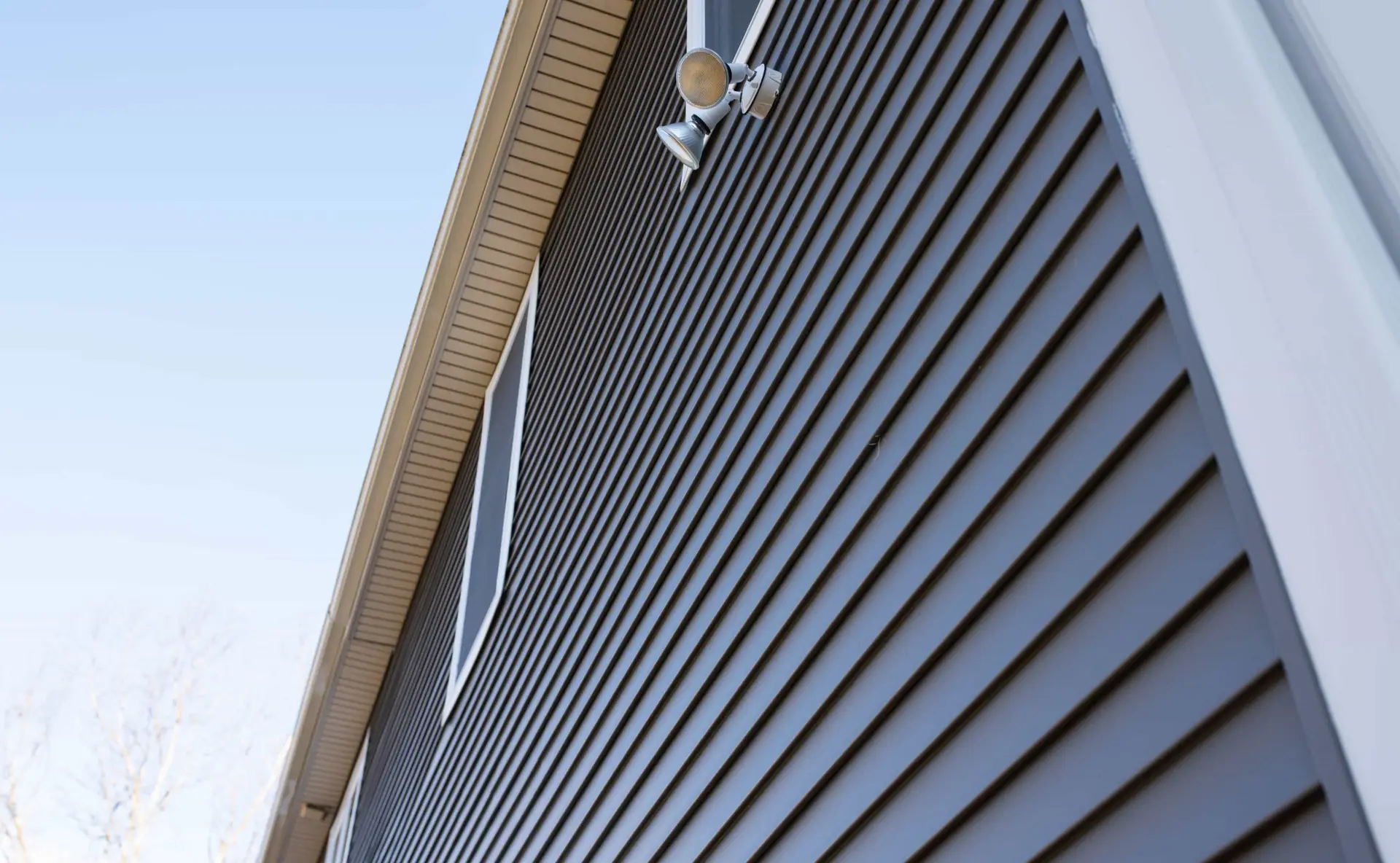 Gray vertical siding on a house wall