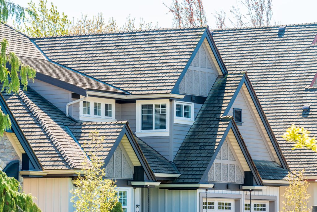 Upscale home with a gray roof and siding
