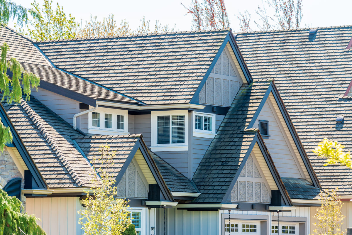Upscale home with a gray roof and siding